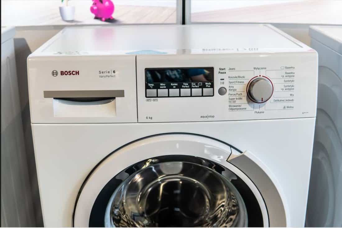 inside Bosch showroom, free-standing Bosch WLK24241PL Serie6 SlimLine washing machine on display Eco VarioPerfect EcoSilence Drive AquaSto
