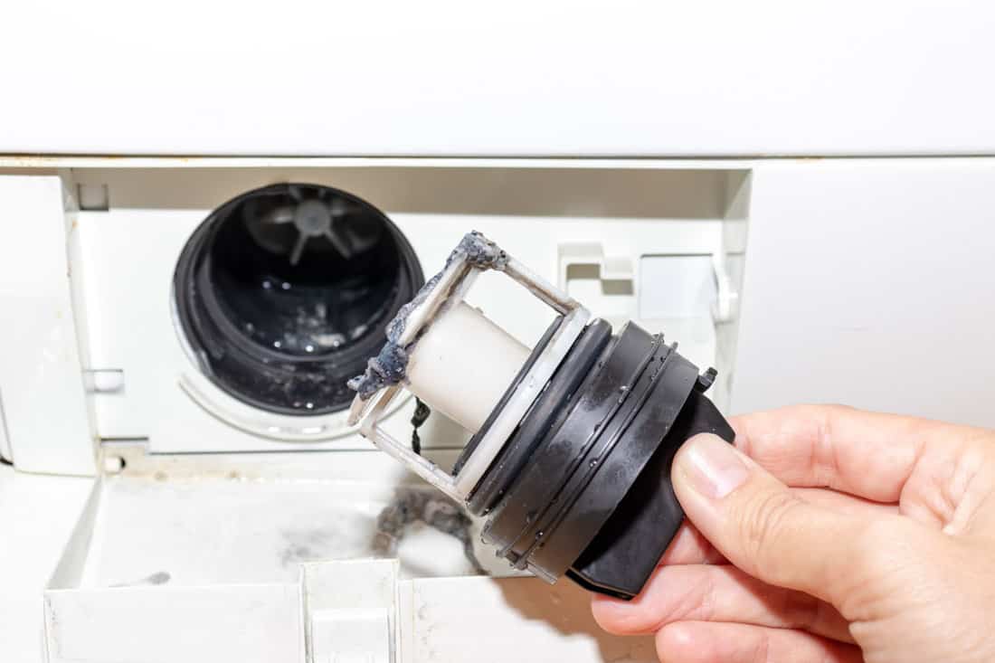 inspecting washing machines dirty clogged drain