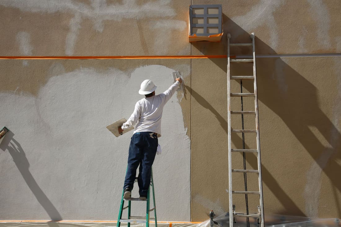 stucco on building wall unidentifiable contractor