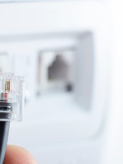 telephone socket and telephone cable on the wall, How To Use House Ethernet Ports