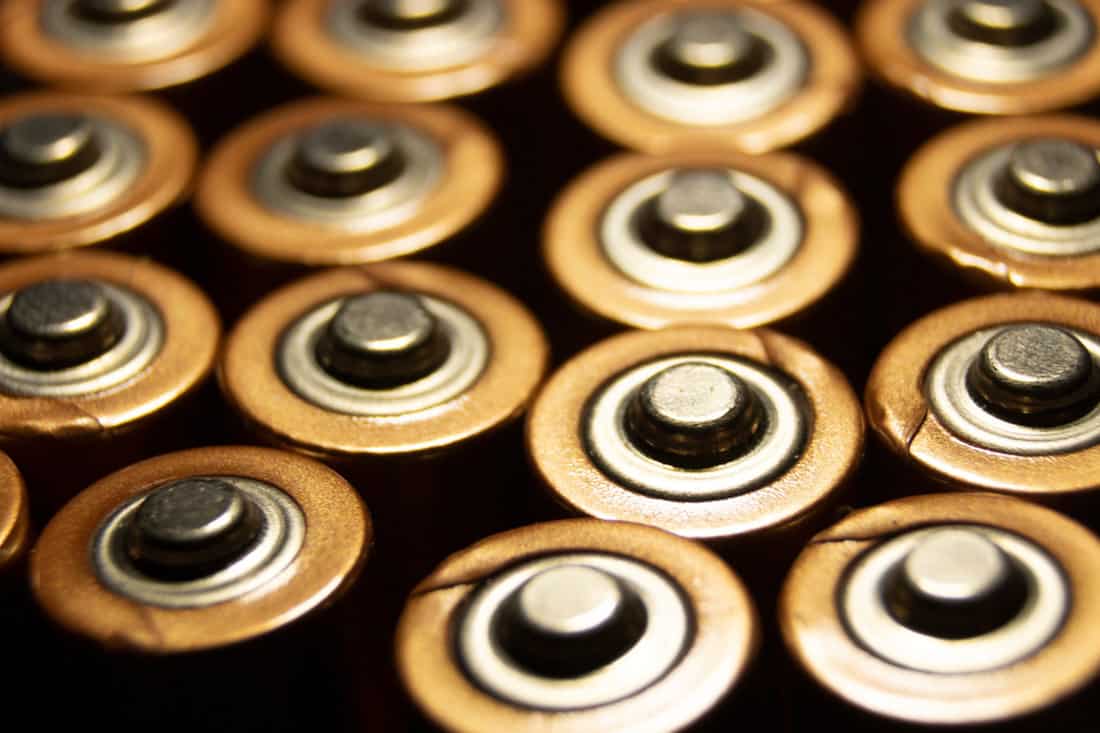 A closeup of the positive ends of battery cells.