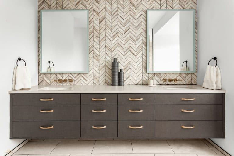 Bathroom in luxury home with double vanity, What Is the Standard Height of a Bathroom Backsplash?