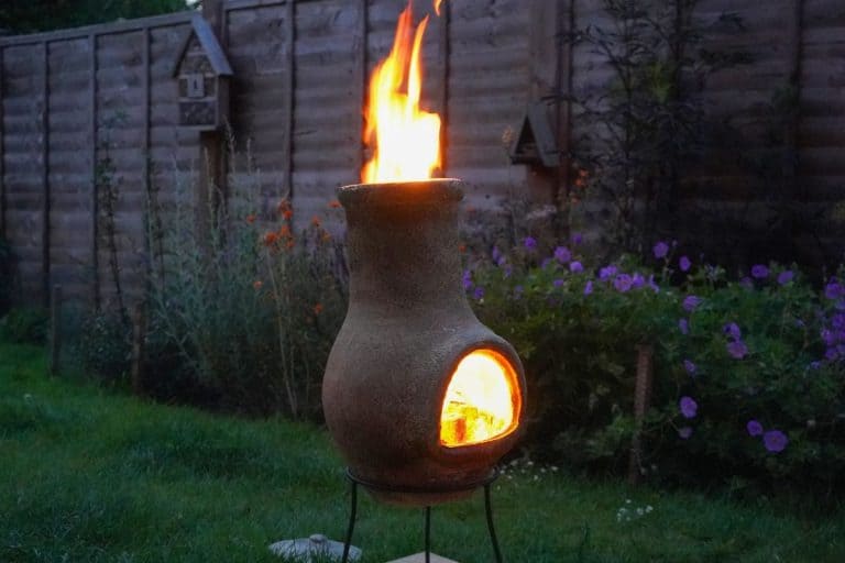 Chiminea on fire in a garden. - Why Does My Chiminea Keep Going Out?
