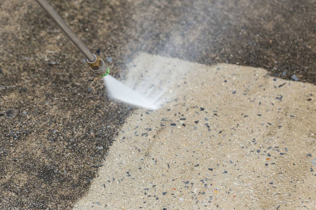 Close up Outdoor floor cleaning with high pressure water jet 