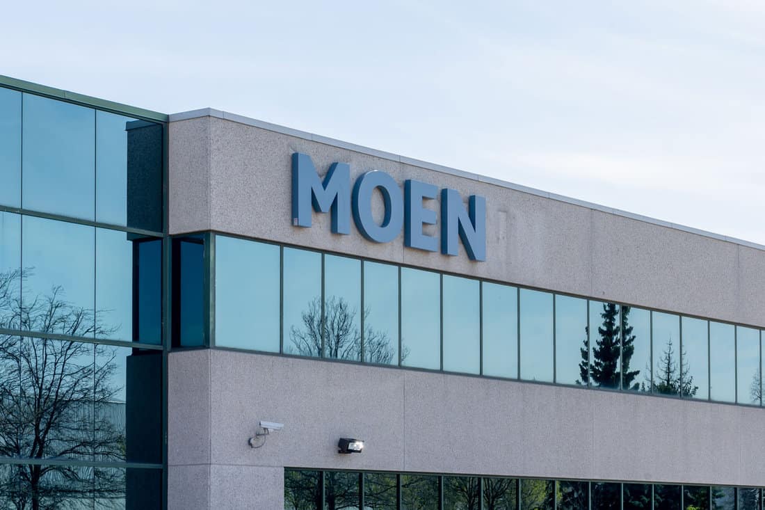 Close up of Moen company sign on the building. Moen is an American product line of faucets and other fixtures.