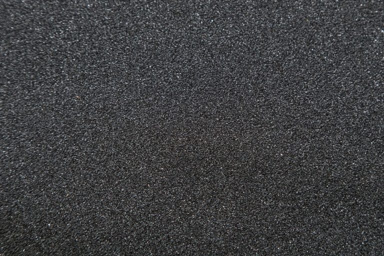 Close up of of skateboard grip tape. Macro photograph of sandpaper texture, How Long Does Granite Grip Last