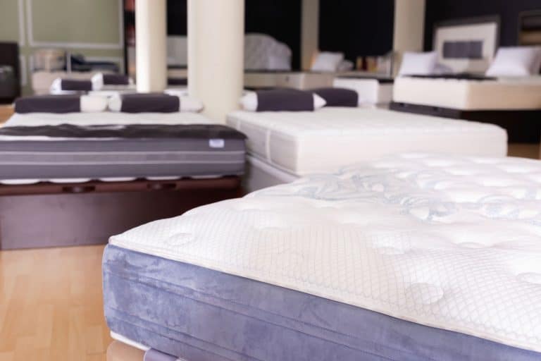 Closeup of new fashionable modern beautiful stylish orthopaedic mattress on display for sale in large furniture store, Can You Put A Regular Mattress On A Sleep Number Base