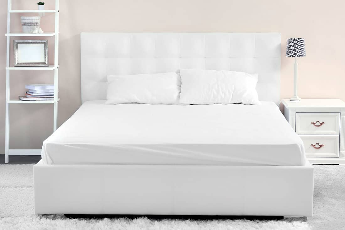 Comfortable white bed in the room