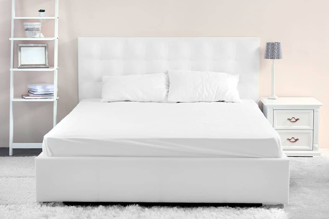 Comfortable white bed in the room