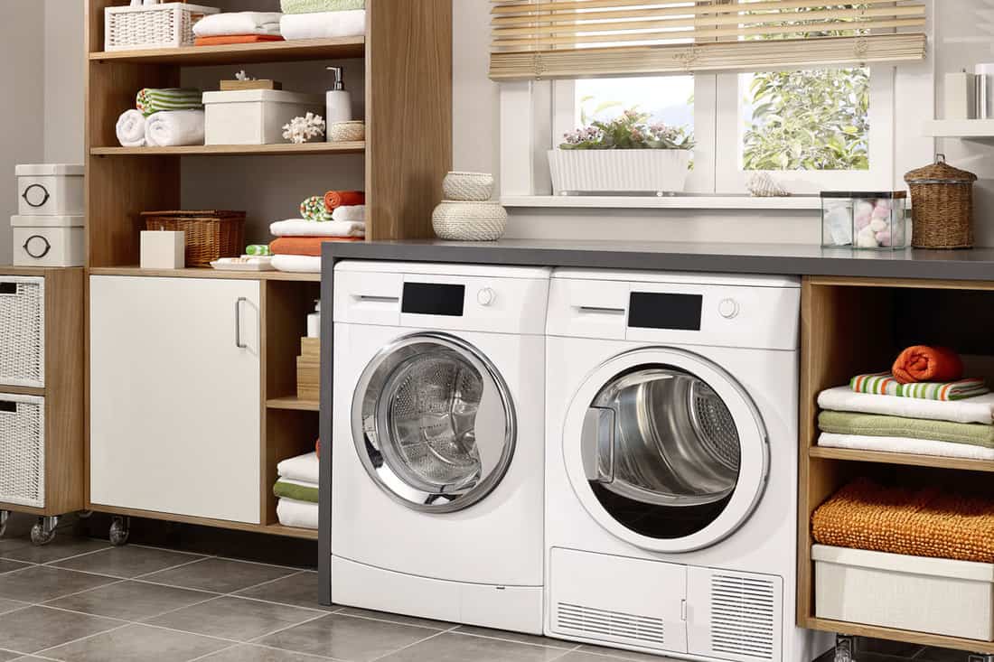 Domestic laundry room with washing machine and drye