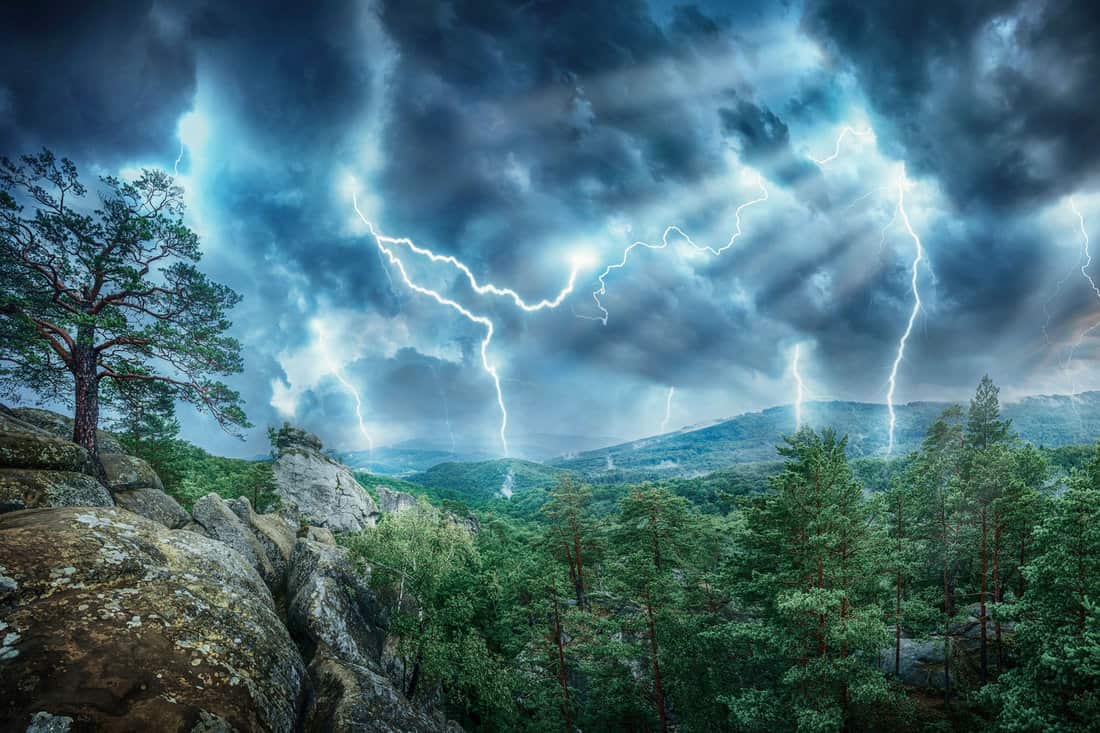 Lightning thunderstorm flash and sun lights in the mountains. Concept on topic weather, cataclysms (hurricane, Typhoon, tornado, storm) 