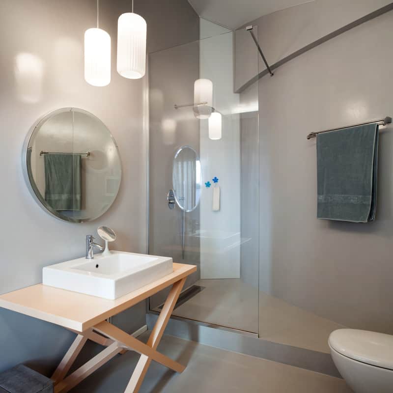 Luxury apartment, modern bathroom with round mirror 