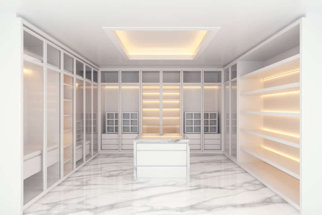 Modern luxury dressing room interior, walk -in closet white wardrobe on marble floor ,3d rendering 