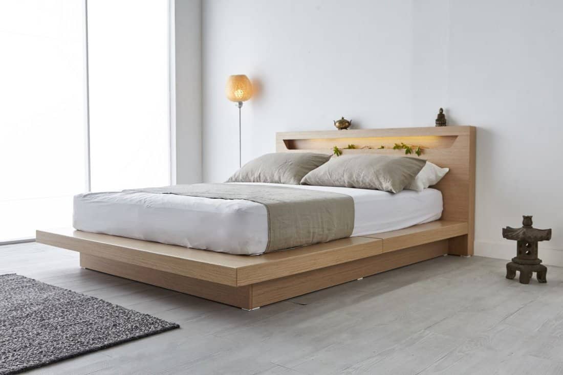 Modern peaceful Bedroom. zen style bedroom. Peaceful and serene bedroom. Wood bed with oriental object.