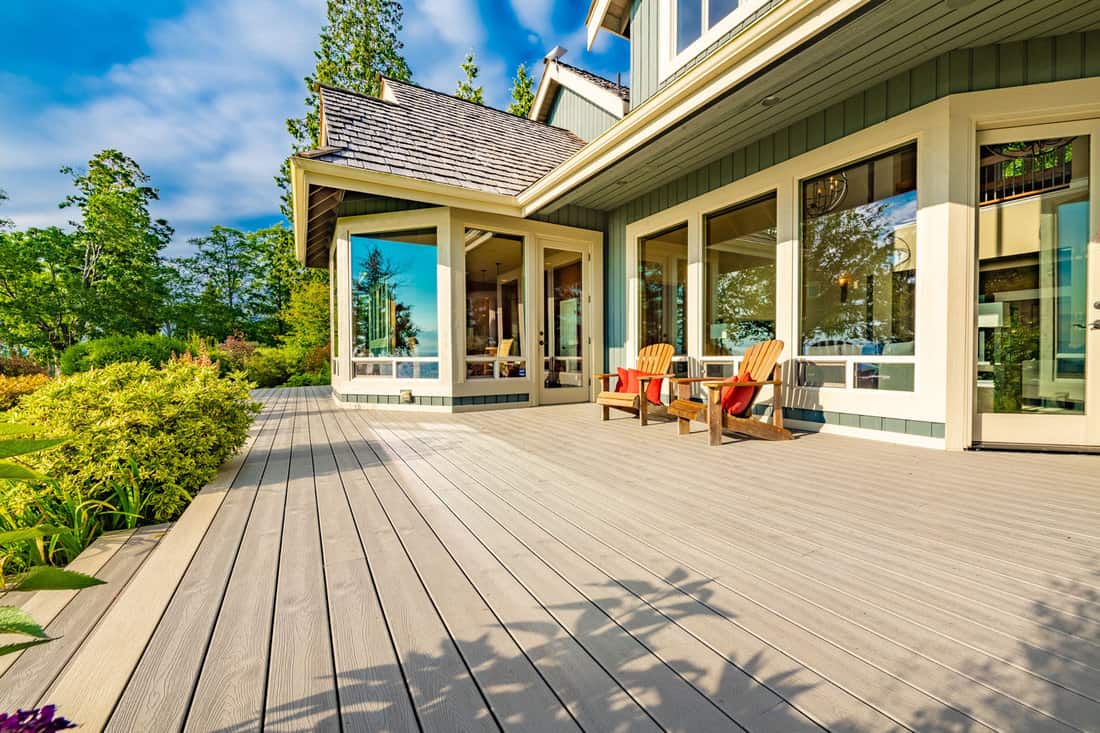 Stately waterfront home in pacific northwest with ocean views expansive decks hot tub front porch and long paved driveway 