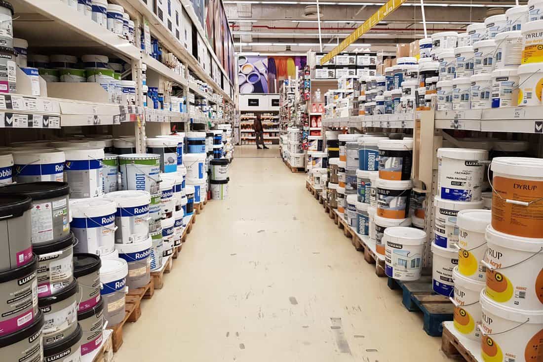 Store aisle with varied choice of paint buckets