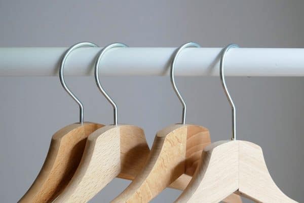 Wooden hangers with metal hooks