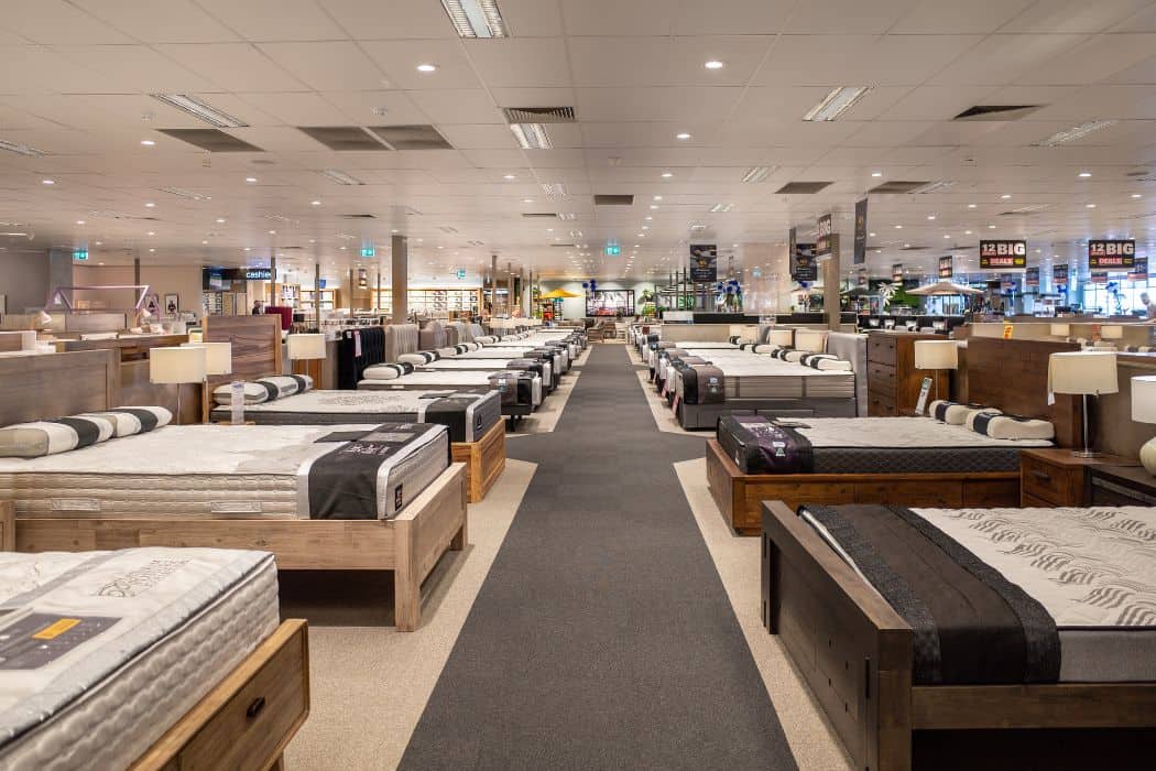 many display mattresses in a store.