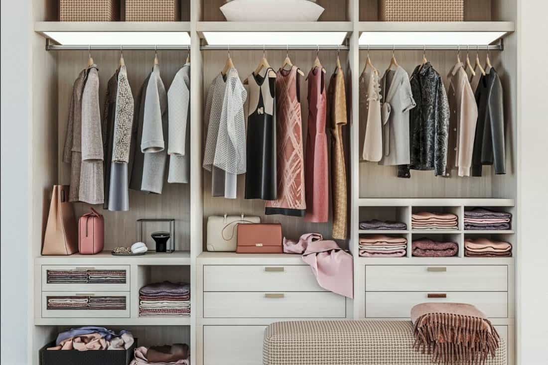 modern wooden wardrobe with women clothes hanging on rail in walk in closet, Scandinavian style, tidily packed,