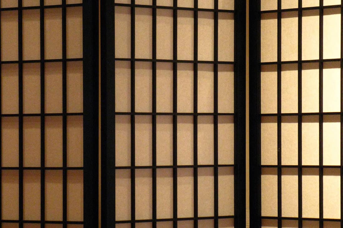 A japanese screen with wooden framing