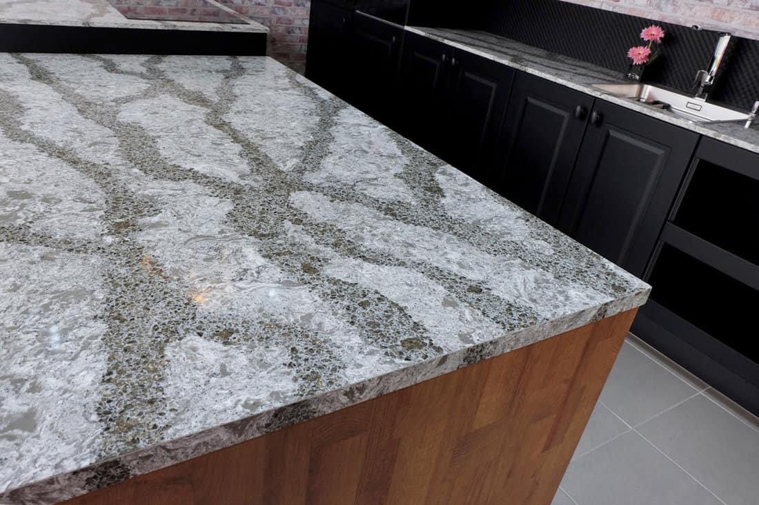 Beautiful quartz stone worktop for wooden kitchen design. 