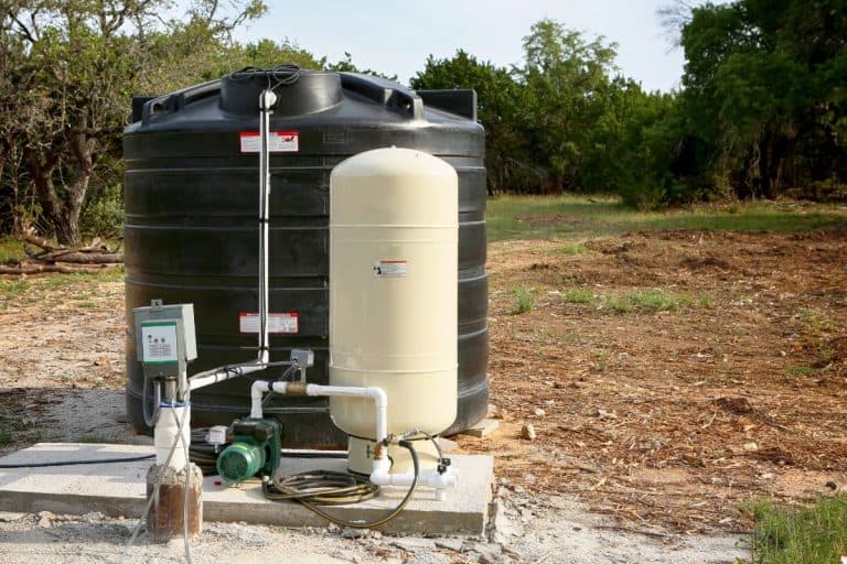 Deep water well set up, countryside construction. Drilled draw well with pressure switch and storage tank.. - How To Reset The Pressure Switch On A Well Pump [Step By Step Guide]