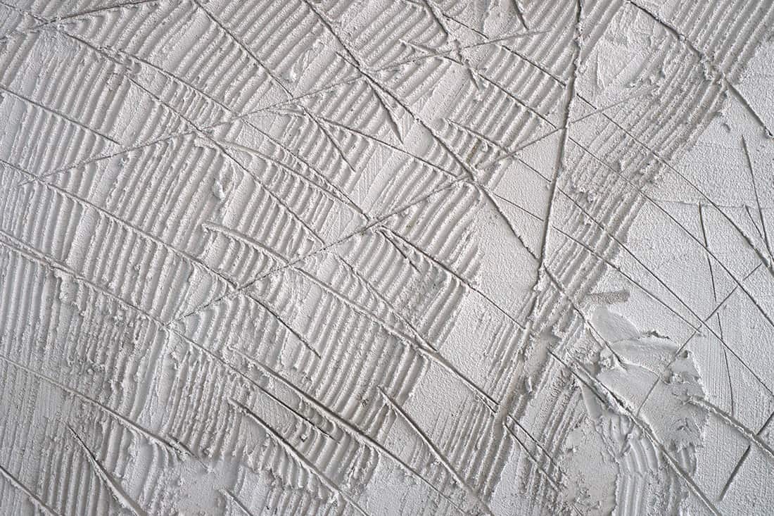 Textured of scratched plastering wall