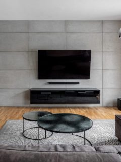 Tv,Living,Room,With,Cement,Wall,And,Wall,Mounted,Fireplace