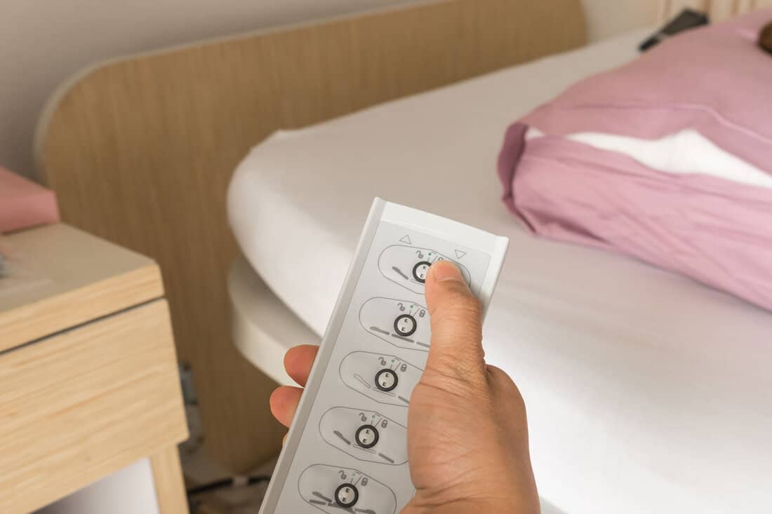 finger press button down at remote control for adjust sick bed 
