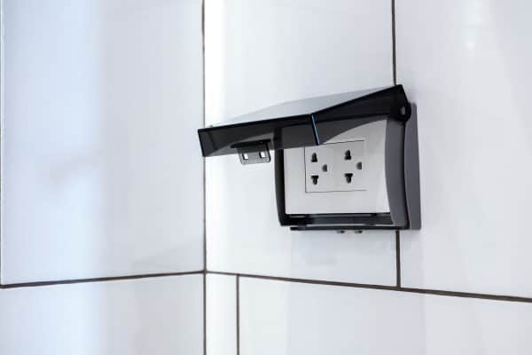hite electrical plug socket plate panel with transparent plastic shield on tiles in bathroom wall, Do I Need A Fused Spur For A Bathroom Mirror?