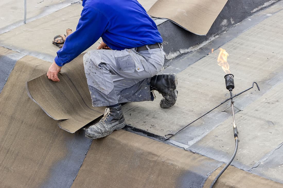 insulation worker propane blowtorch floor slab