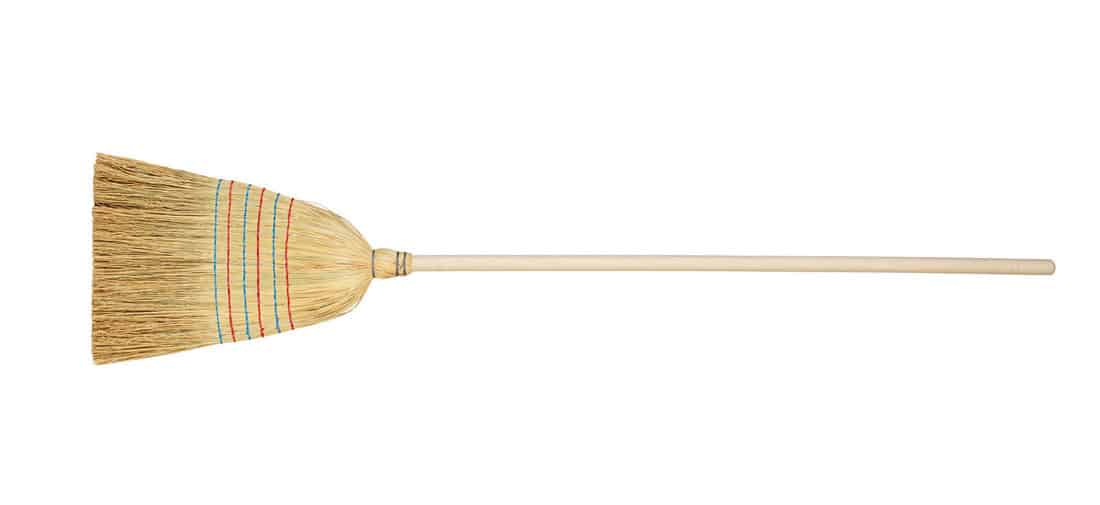 straw broom on white background 