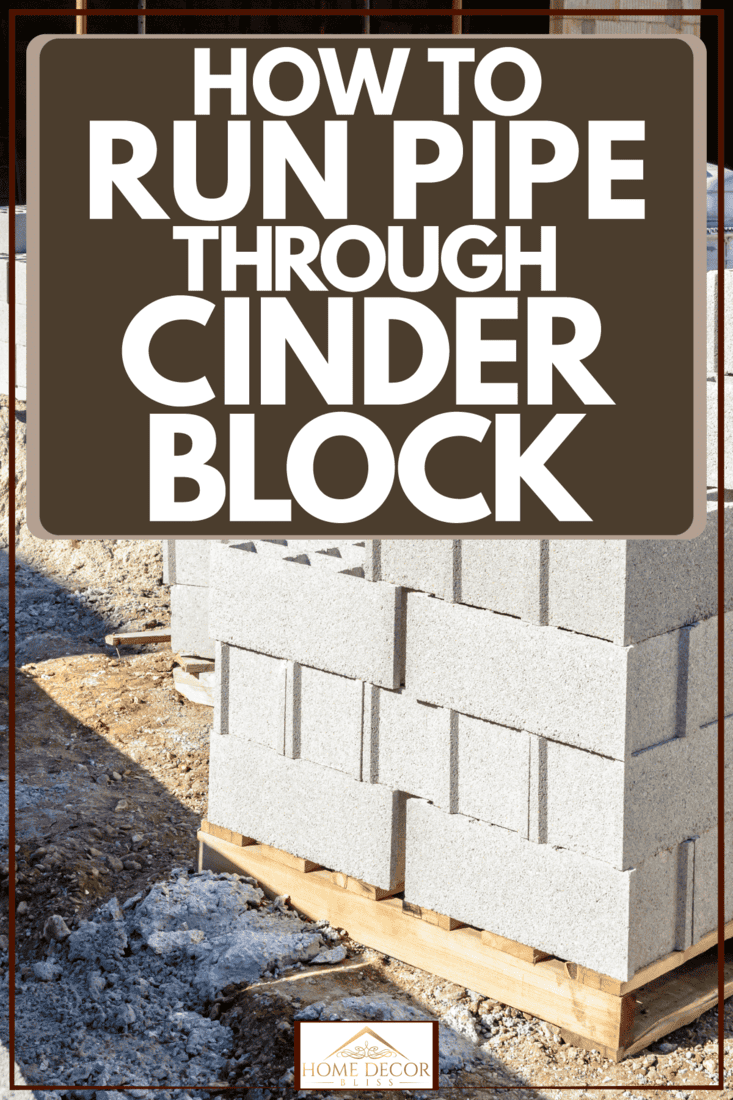 Cinder block piled outside a house undergoing construction, How To Run Pipe Through Cinder Block