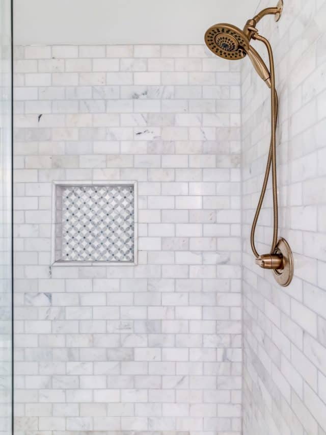 An,Empty,Shower,With,Subway,Tiles,And,Small,Ceramic,Tiles
