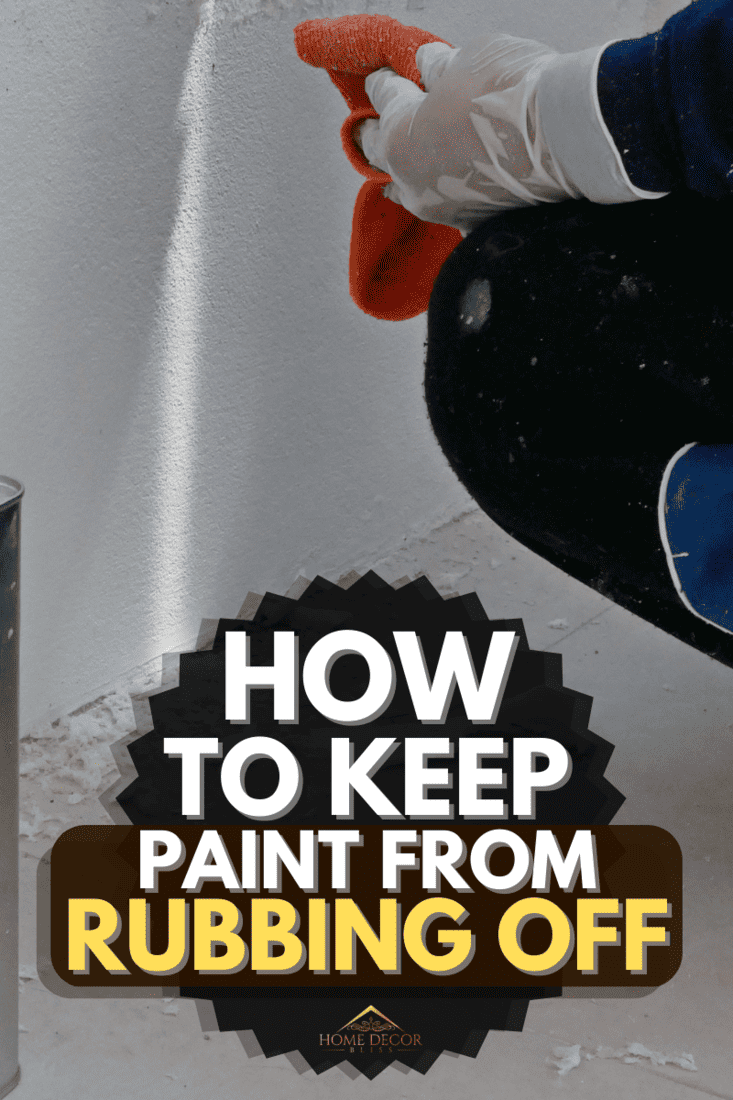A man wiping a wall , How To Keep Paint From Rubbing Off