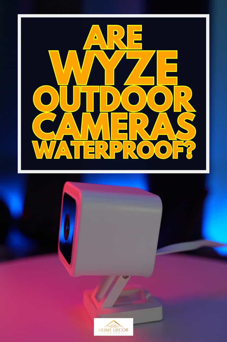Tiny white security camera on a turn table in a studio, Are Wyze Outdoor Cameras Waterproof?
