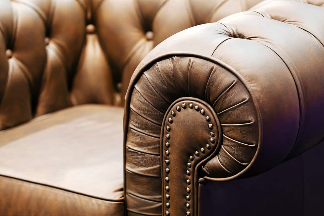 Detail of classic furniture sofa in living room.