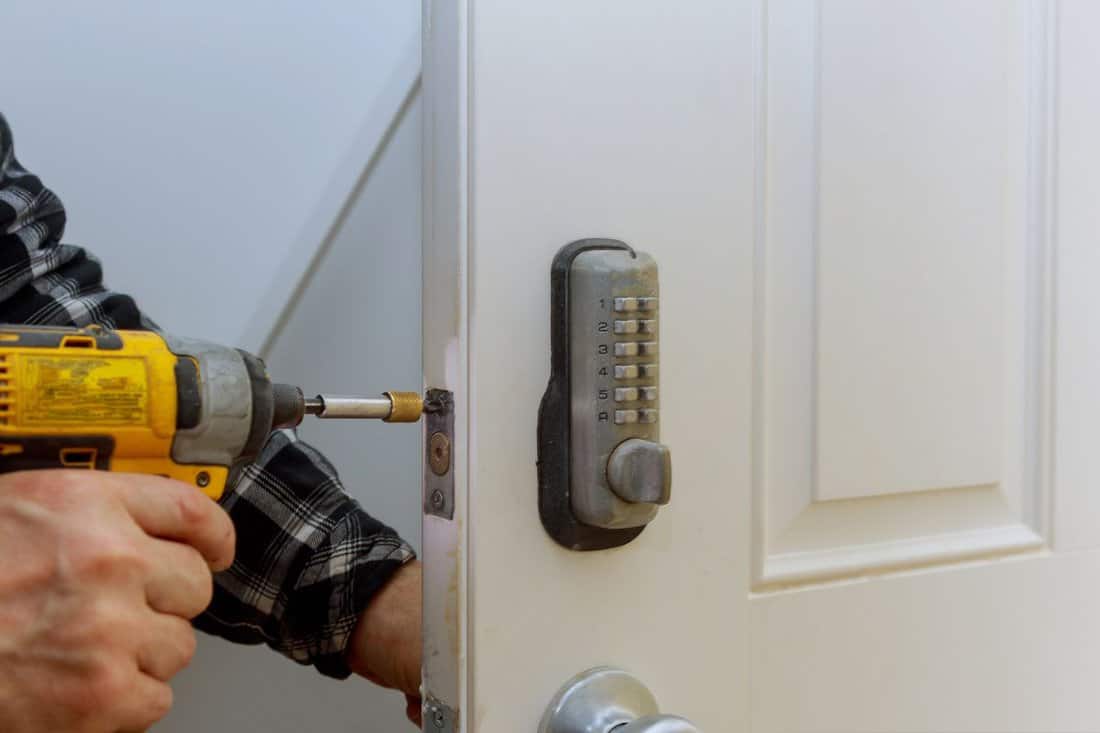 Digital door lock security systems for good safety of apartment door. Electronic door handle with key.