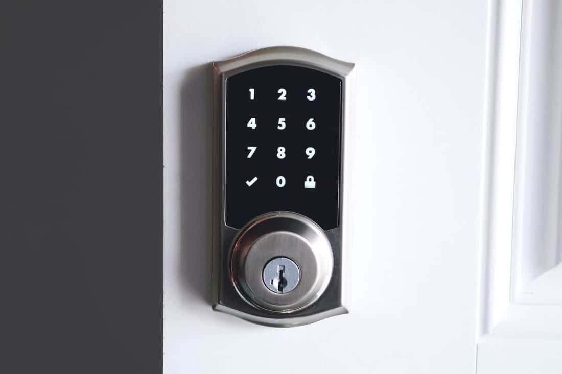 Digital-smart-door-lock-security-system-with-the-password-close-up-on-numbers-on-the-screen.