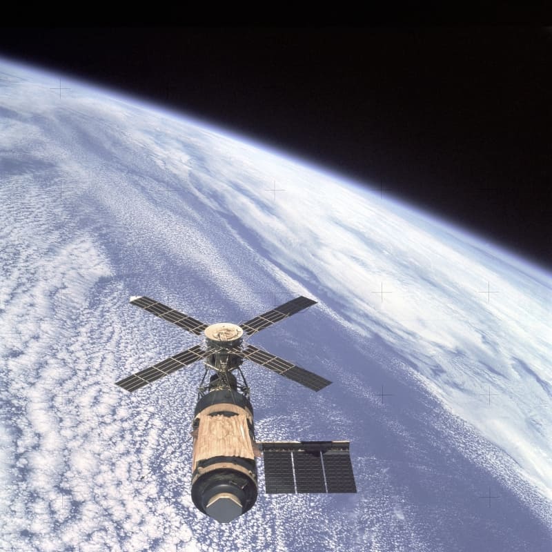 Skylab Orbital Workshop in Earth orbit. The golden shape is a NASA made parasol that replaced heat shield damaged during the unmanned launch on May 14, 1973. Feb. 8, 1974.