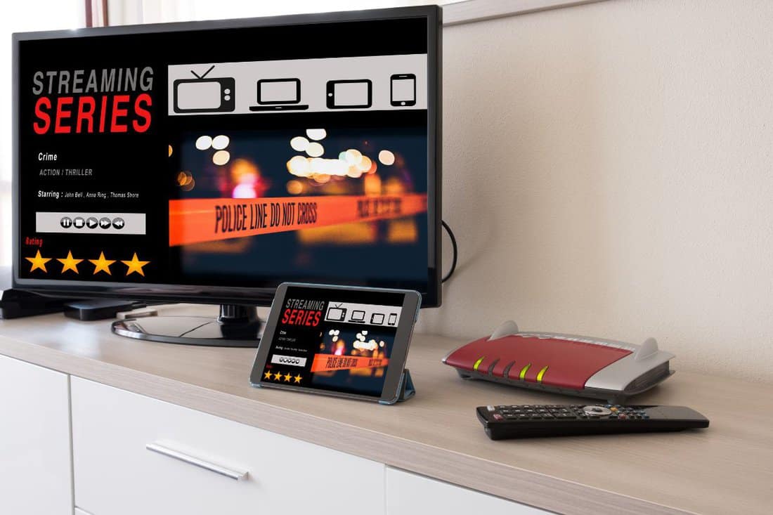 Smart tv and digital tablet connected to the internet modem network.