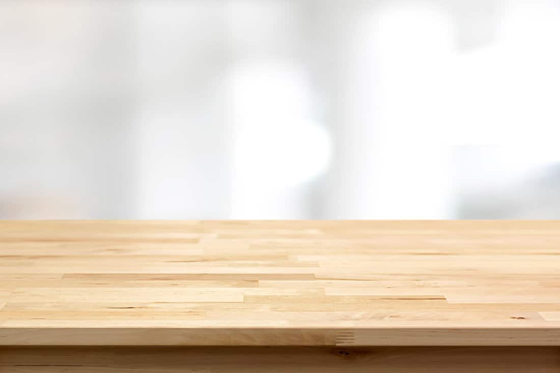 Wood table top on blur white gray abstract background - can be used for display or montage your products