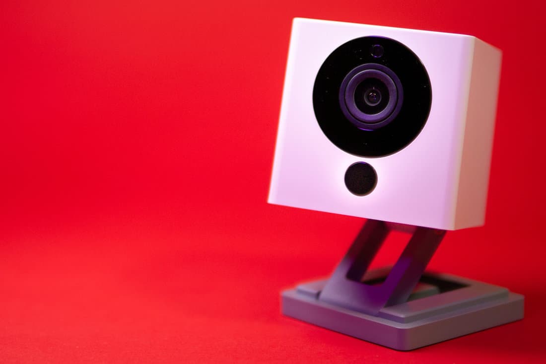 Wyze security camera isolated in red