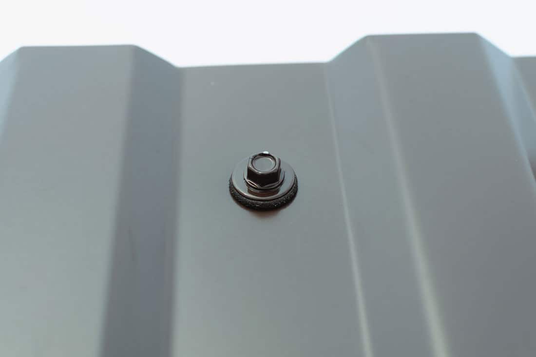 Up close photo of a metal roof screw