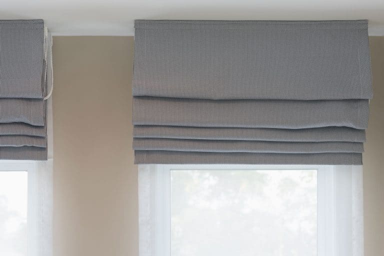 closed up of beautiful grey curtain in cozy room home, interior design concept, Do Roman Shades Block Light