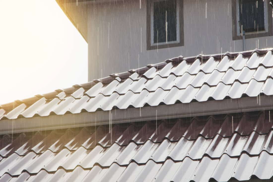 Strong rain against metal roofing