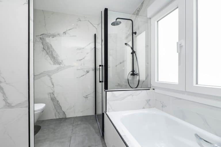 Marble walled shower wall, 5 Best Types Of Shower Wall Panels To Consider For Your Bathroom Renovation [The Ultimate Guide]