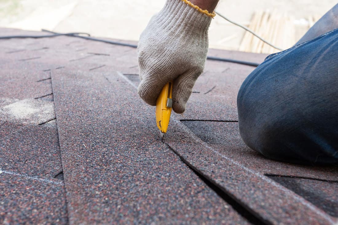 Cutting composite asphalt shingle roofing