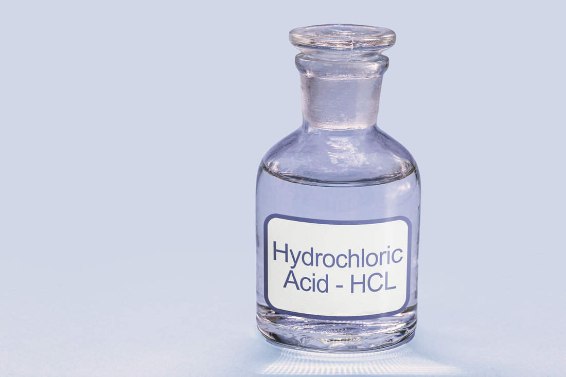 A container of hydrochloric acid, a chemical solution utilized for cleaning, metal galvanization, leather tanning, and the production of various goods