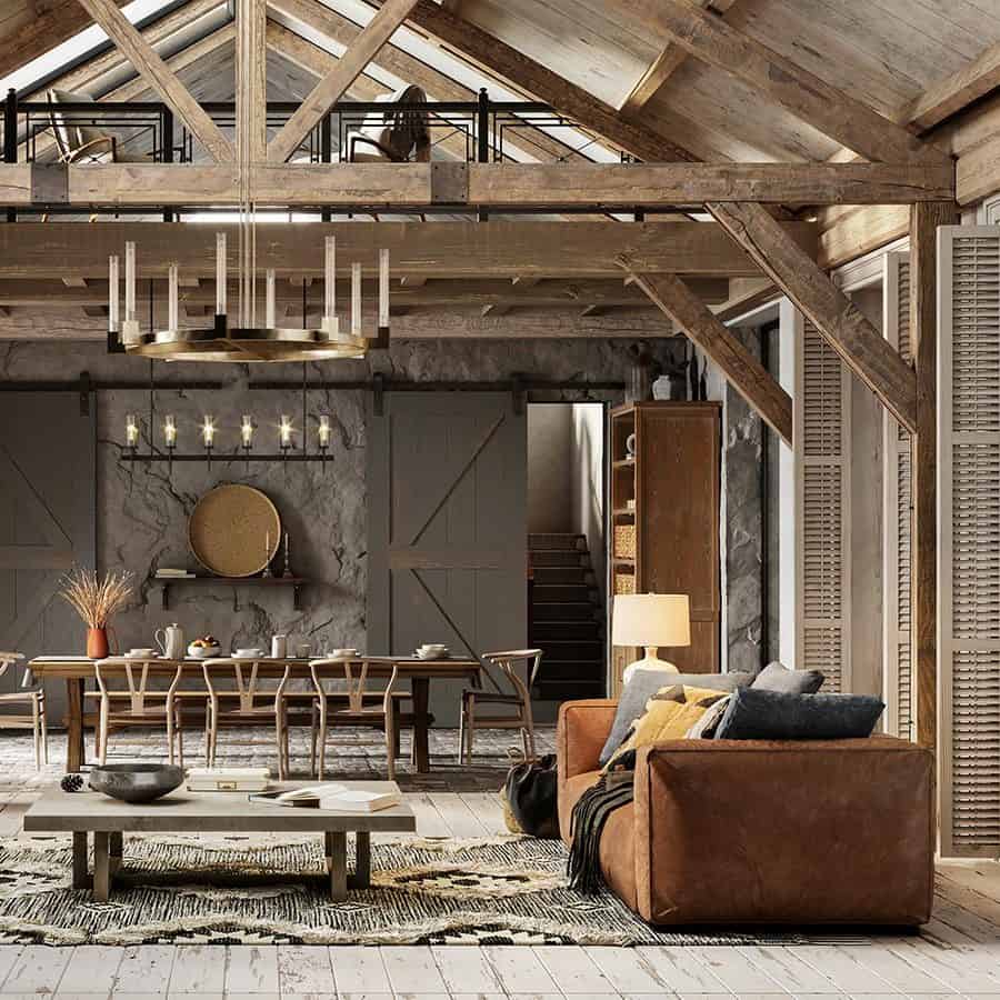 Beautiful living room interiors of a winter cottage. rustic design. brown couch. dining area with rustic table and chairs. barn doors. 
